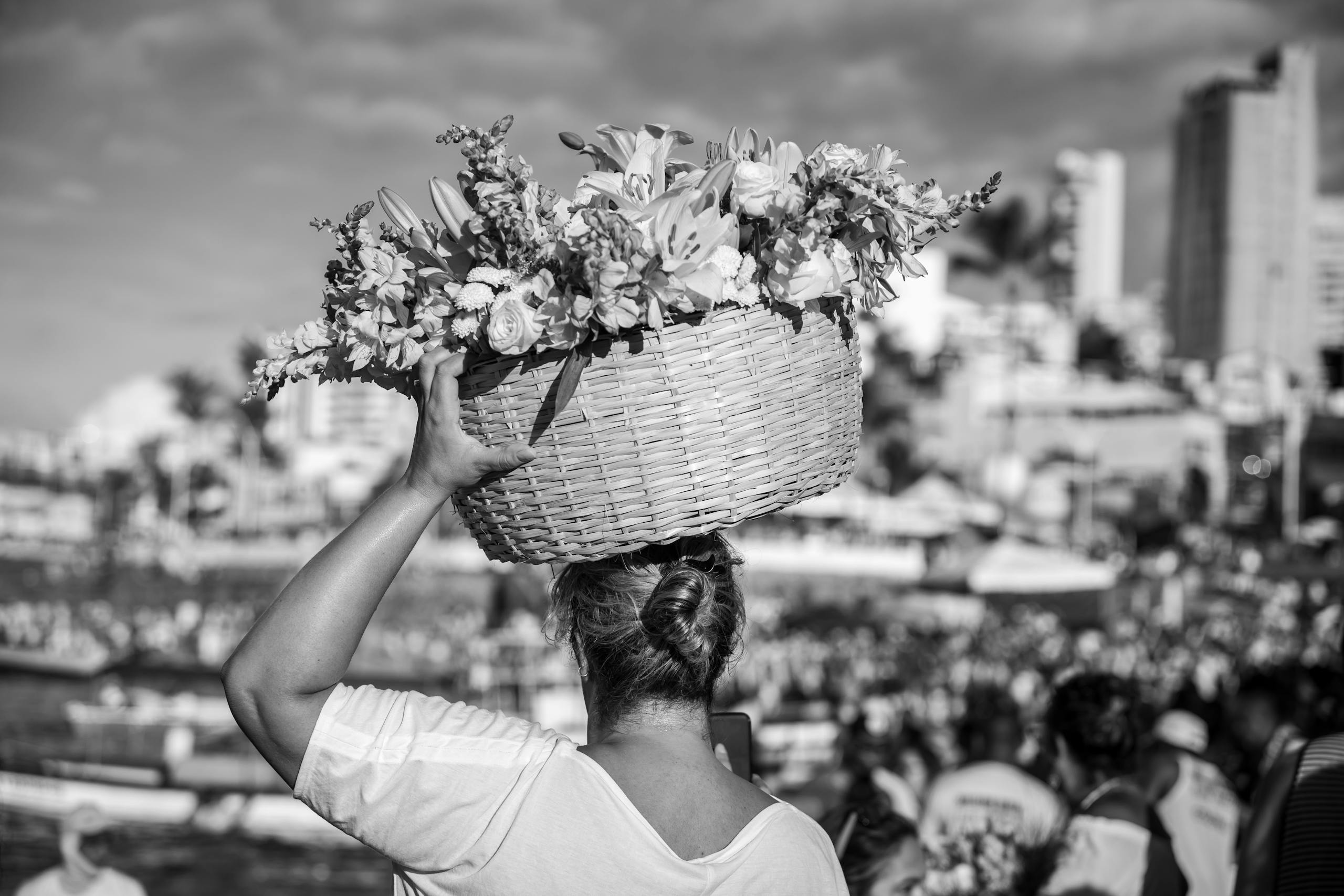 Woman Carrying Bouquet of Flowers